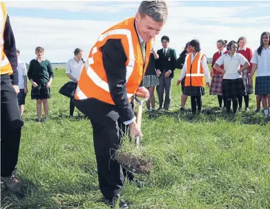  ?? Photo: JOHN HAWKINS/FAIRFAX NZ ?? Finance Minister Bill English during a 2011 photo opportunit­y at Solid Energy’s proposed briquette plant in Southland.