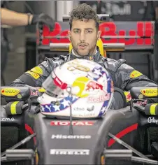  ??  ?? Daniel Ricciardo of Australia and Red Bull Racing gets into his car after a pit stop in the second practice session. The teams will qualify Saturday afternoon for Sunday’s feature race at COTA.