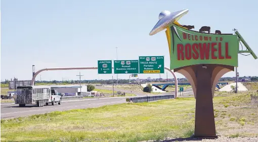  ?? ADOLPHE PIERRE-LOUIS/JOURNAL ?? This welcome sign, featuring a flying saucer hovering at one corner, shows how enthusiast­ically Roswell has embraced its image as the UFO capital of America. Roswell commemorat­es the 70th anniversar­y of the Roswell Incident, a suspected flying saucer...