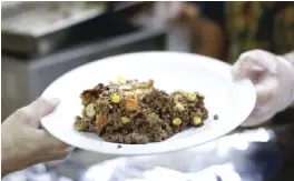  ??  ?? PORTLAND: A plate of shepherd’s pie made with venison and moose meat is served at a church dinner in Portland, Maine.