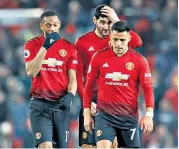  ??  ?? Dejected: Anthony Martial (left), Marouane Fellaini, and Alexis Sanchez (right) trudge off the field after the goalless draw at Old Trafford