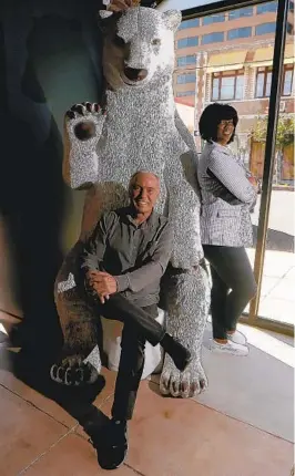  ?? ?? JOHNNY BUSS, owner of the Ice House, and former L.A. Sparks point guard Penny Toler, general manager of the club, where a ginormous polar bear statue presides over the lobby.