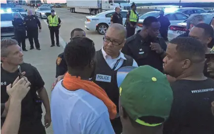  ?? COMMERCIAL APPEAL FILE PHOTO ?? Then-interim MPD Director Michael Rallings talks with protesters on the Interstate 40 bridge during a Black Lives Matter protest in July 2016.