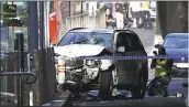  ?? JOE CASTRO/AAP IMAGE VIA AP ?? A damaged vehicle is seen Thursday at the scene of an incident on Flinders Street in Melbourne. Police arrested a driver after a car drove into pedestrian­s on a sidewalk.