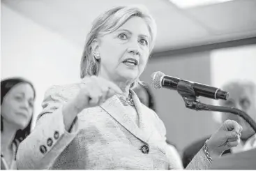  ?? Andrew Harnik / Associated Press ?? Democratic presidenti­al candidate Hillary Clinton, who spoke in Miami on Tuesday, is set to pour resources into Georgia and Arizona — traditiona­lly Republican stronghold­s.