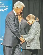  ?? Arkansas Democrat-Gazette/JOHN SYKES JR. ?? Former President Bill Clinton welcomes Supreme Court Justice Ruth Bader Ginsburg to the stage Tuesday after introducin­g her to the audience.