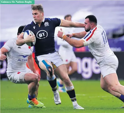  ??  ?? Hands off:
Scotland ace Duhan van der Merwe battles with Gael Fickou of France