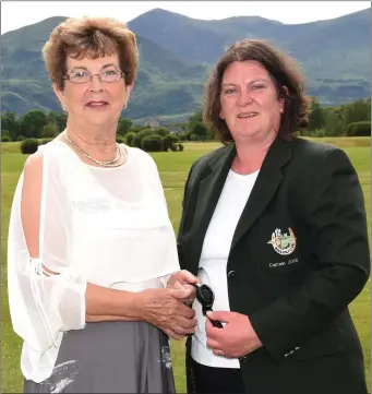  ??  ?? Ross Golf Club Lady Captain Mary McCormick (right) presenting her Lady Captain’s prize to winner Margaret O’Donoghue sponsored by Torc Travel Killarney at Ross Golf Club.
Photo by Michelle Cooper Galvin