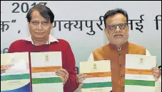  ?? PTI ?? Commerce and industry minister Suresh Prabhu (left) and finance secretary Hasmukh Adhia at the release of the midterm review of the foreign trade policy, in New Delhi on Tuesday