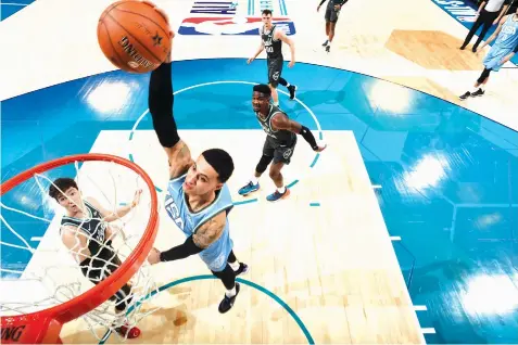  ??  ?? Kyle Kuzma #0 of the U.S. Team dunks the ball against the World Team during the 2019 Mtn Dew ICE Rising Stars Game at the Spectrum Center in Charlotte, North Carolina. AGENCE FRANCE PRESSE