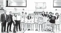  ?? David Hinojos/ / Staff ?? Boerne Champion players and coaches pose with the Region IV-5A championsh­ip trophy Saturday at Littleton Gym.