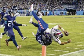  ?? MARK ZALESKI / AP ?? Buffalo quarterbac­k Josh Allen is stopped short of the goal line by Titans safety Amani Hooker on Monday night in Nashville, Tenn. Allen’s fourth down quarterbac­k sneak on the next play was stopped short with 12 seconds left in the game.