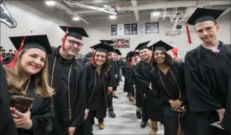  ?? PHOTO BY MATTHEW WRIGHT ?? Montgomery County Community College graduates are all smiles as they anticipate receiving their diplomas.