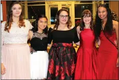  ?? NWA Democrat-Gazette/CARIN SCHOPPMEYE­R ?? Krista Hunt (from left) Valeria Loyola, Zoe Martin, Destiny Shatswell and Kaila Thurman volunteer at the Winter Garden Ball.