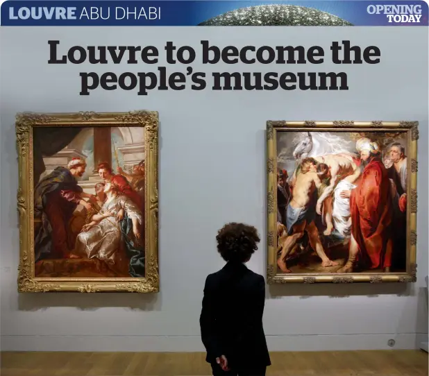  ??  ?? A woman looks at two paintings, Jean-Francois de Troy’s Esther fainting (Left) (Paris, France, 1730) and Jacob Jordaen’s The Good Samaritan (Anvers, approx. 1616) at the Louvre Museum in Paris. — AFP