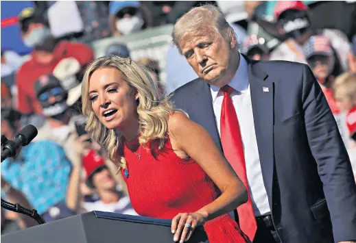  ??  ?? Donald Trump and Kayleigh Mcenany, the White House press secretary, at a campaign rally at Prescott airport, Arizona. Below, Joe Biden arrives at the Queen theatre in Wilmington, Delaware, to tape an interview with CBS’S 60 Minutes. Right, Kamala Harris, Mr Biden’s running mate, speaks at the Central Florida Fairground­s, Orlando