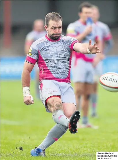  ??  ?? James Garland kicks a conversion for Aberavon.