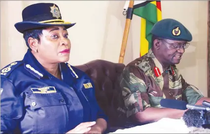  ?? - Picture by Justin Mutenda ?? Zimbabwe Republic Police spokespers­on Senior Assistant Commission­er Charity Charamba (left) and her Zimbabwe Defence Forces counterpar­t, Colonel Overson Mugwisi, address the media in Harare yesterday.