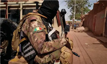  ??  ?? A Malian soldier on patrol. ‘Authoritie­s who are inclined to show some kind of response carry out abuses and frame it as counter-terrorism success.’ Photograph: Michele Cattani/AFP via Getty Images