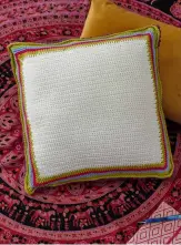  ??  ?? Make the back panel in one colour in double crochet throughout, then work the border