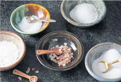  ?? TOM MCCORKLE FOR THE WASHINGTON POST ?? While the four types of salt — table, kosher, sea and finishing — are all essentiall­y identical, the difference is in how they’re made.