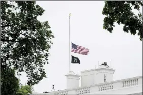  ?? AP photo ?? The American flag flies at half-staff at the White House in Washington on Thursday, as the Biden administra­tion commemorat­es 1 million American lives lost due to COVID-19.