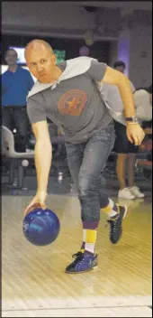  ?? LOREN TOWNSLEY/LAS VEGAS REVIEW-JOURNAL FOLLOW @LORENTOWNS­LEY ?? Ben Schkade is one of 300 bowlers who participat­ed in the Homeless Youth in the Alley bowling tournament fundraiser Saturday at the Suncoast Bowling Center.