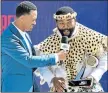  ?? Picture: GETTY IMAGES ?? THANKS TO BLESSED AFRICA: Terrence J presents an award to Sjava onstage at the BET Awards