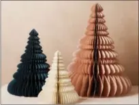  ?? PHOTO COURTESY OF WEST ELM ?? Accordion paper trees in a variety of shades make a lovely seasonal display. From West Elm, $19-49.