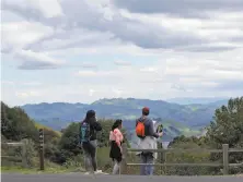  ?? Carlos Avila Gonzalez / The Chronicle ?? A family hikes in Tilden Regional Park in Berkeley in March. A new website offers tips on Bay Area parks’ shifting rules.