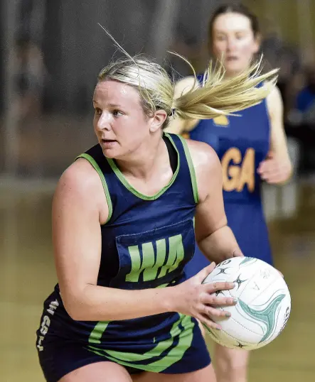 ?? PHOTO: GREGOR RICHARDSON ?? Eyes up . . . College A wing attack Zoey Flockton looks for an outlet during the Dunedin premier netball semifinal against Phys Ed A at the Edgar Centre on Saturday.