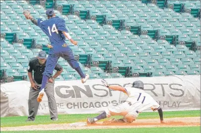  ??  ?? Grant’s Tino Torres slides into third base as Morgan Park’s Lavar Reed leaps to catch a high throw Tuesday.