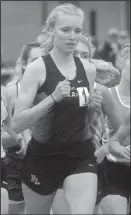  ?? Staff photo/Corey Maxwell ?? Fort Loramie’s Claire Rethman runs the 1,600 mile Friday night in Troy.
