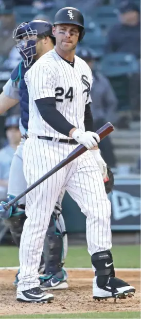  ??  ?? JONATHAN DANIEL/ GETTY IMAGES Sox designated hitter Matt Davidson heads back to the dugout after striking out in the ninth inning against the Mariners at Guaranteed Rate Field.