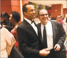  ?? Dan Haar/Hearst Connecticu­t Media /\ ?? Connecticu­t state Treasurer Shawn Wooden, center, with Alan Lazowski, chairman and CEO of LAZ Parking, chat at the inaugural ball in Hartford Jan. 9. Lazowski, who founded LAZ in 1981 when he was a student at UConn, is a neighbor and friend of Wooden’s. The treasurer recently launched the state’s CHET savings program competitio­n for students in Connecticu­t.