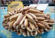  ?? THE ASSOCIATED PRESS ?? Hot dogs are on display on stage ahead of the Nathan’s Famous Fourth of July hot dog eating contest Wednesday.