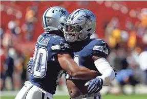  ?? GEOFF BURKE/USA TODAY SPORTS ?? Running back Ezekiel Elliott, right, has helped ease the transition to the NFL for fellow Cowboys running back Tony Pollard.