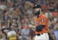  ?? DAVID J. PHILLIP — THE ASSOCIATED PRESS ?? Astros starting pitcher Dallas Keuchel reacts after striking out the Yankees’ Aaron Judge during the third inning of Game 1 of the ALCS on Oct. 13 in Houston.
