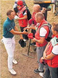  ?? PAUL ELLIS/AFP/GETTY IMAGES ?? Jordan Spieth paid 20 pounds for a “very British haircut” between the second and third rounds at Carnoustie.