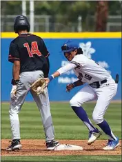  ?? ?? Cal State Bakersfiel­d Jacob Gutierrez catches the ball after an attempt to pick off Pacific’s Tony Otis.