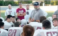  ?? Graham Thomas/Siloam Sunday ?? Siloam Springs football coach Bryan Ross speaks to the Panthers after hosting a football team camp with Gravette and Farmington on Thursday at Panther Stadium.