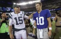  ?? JULIO CORTEZ — THE ASSOCIATED PRESS ?? New York Jets' JoshMcCown ( 15) talkswith New York Giants' Eli Manning ( 10) after a preseason NFL football game Saturday in East Rutherford, N. J. The Giants won 32- 31.