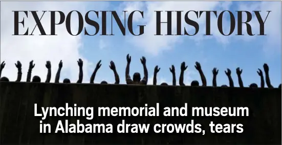  ?? BRYNN ANDERSON — THE ASSOCIATED PRESS ?? This photo shows a bronze statue called “Raise Up” as part of the display at the National Memorial for Peace and Justice, a new memorial to honor thousands of people killed in racist lynchings, Monday in Montgomery, Ala. The national memorial aims to...