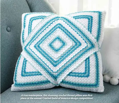  ??  ?? A true masterpiec­e, this stunning crochet thread pillow won first place at the annual Crochet Guild of America design competitio­n!