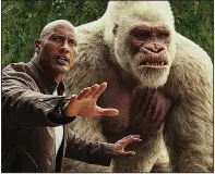  ??  ?? Dwayne Johnson
(left) stars as Davis Okoye and Jason Liles plays George in the Warner Bros.’ release Rampage. It came in fifth at last weekend’s box office and made about $4.6 million.