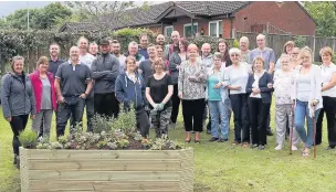  ??  ?? ●●Staff from Rochdale Boroughwid­e Housing who tidied up the garden at Thistleyfi­eld independen­t living scheme in Milnrow