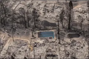  ?? MARCUS YAM/LOS ANGELES TIMES ?? Aerial view of the damage caused by a fire that destroyed the Coffey Park neighborho­od in Santa Rosa on Wednesday.