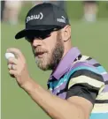  ?? CHRIS CARLSON/ THE ASSOCIATED PRESS ?? Graham DeLaet of Weyburn, Sask., holds his ball after a birdie on the second hole Friday during the second round of the Masters golf tournament.