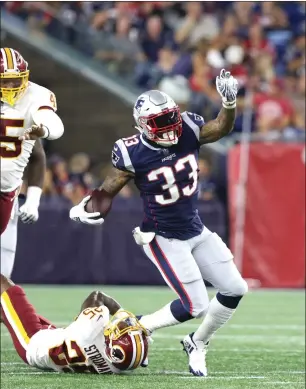  ?? Photo by Louriann Mardo-Zayat / lmzartwork­s.com ?? Patriots running back Jeremy Hill (33) carries the ball in the first quarter of Thursday night’s preseason opener against the Redskins. Pick up Saturday’s edition for a recap of the contest.