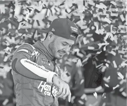  ?? COLIN E. BRALEY/AP ?? Kyle Larson reacts in Victory Lane after winning a NASCAR Cup Series auto race at Kansas Speedway in Kansas City, Kan., on Sunday.